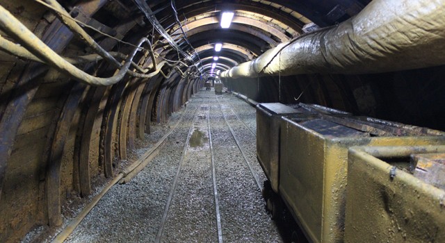 Level 6 tunnel between bottom of incline shaft and collar of internal shaft. Rails and cars are used to haul material and supplies to Strieborna crosscut.