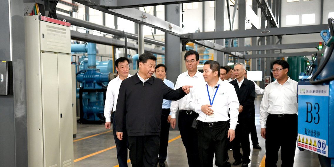 Chinese President Xi Jinping and Vice Premier Liu He, second from right, at the JL MAG Rare-Earth factory in Ganzhou, China. Source: Business Insider -Xinhua/Xie Huanchi via Getty
